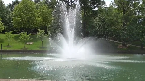 Fountain in a Small Lake Stock Footage 77486494