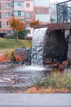Fountain with a small pond in the fall Stock Photos