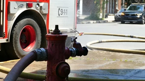 Fountain splashing at fire scene Stock Footage 114812502