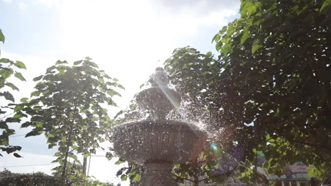 Fountain splashing in the sun Stock Footage 141727977