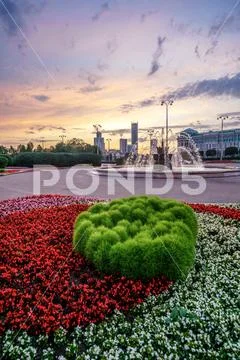 Fountain in the square of labour on sunset Stock Photos