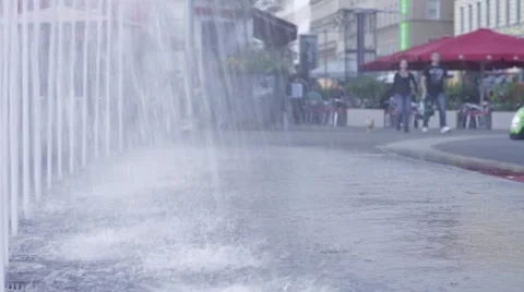 A fountain on the street with people Stock Footage 56937853