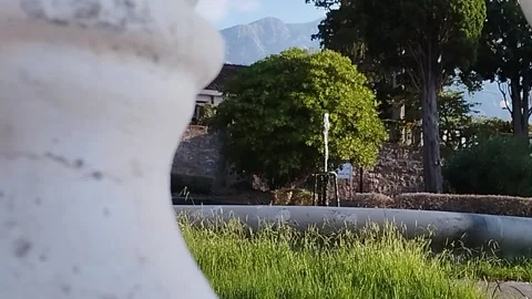 Fountain, view through the white columns of the fence Stock Footage 206302832