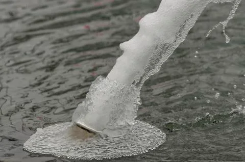 Fountain in winter close-up Stock Photos