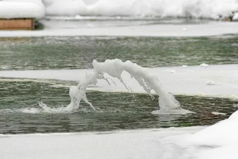 Fountain in winter close-up Stock Photos