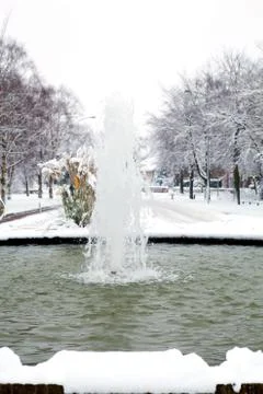 Fountain in winter setting Stock Photos