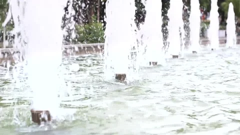 Fountain work with a time interval, close up emerald water and refreshing jets Video stock 134812828