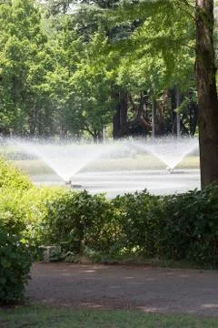 Fountains in a park Stock Photos