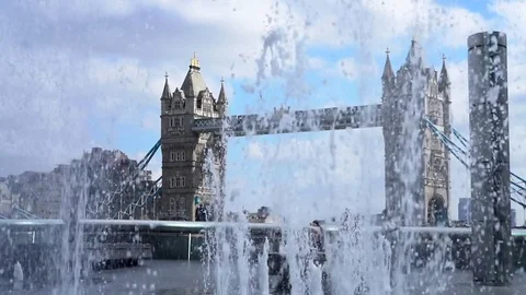 Fountains Spraying in front of Views of Tower Bridge, London UK Video stock 80536823