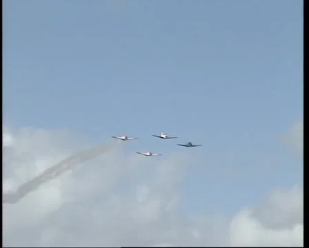 Four (4) US Air Force Harvard (Texan) AT-6 planes in a flyby Stock Footage 1075488