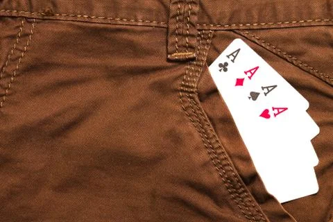 Four ace cards inside brown jeans front pocket Stock Photos
