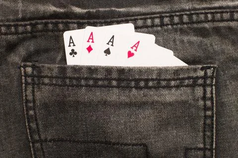 Four ace cards inside gray jeans back pocket Stock Photos