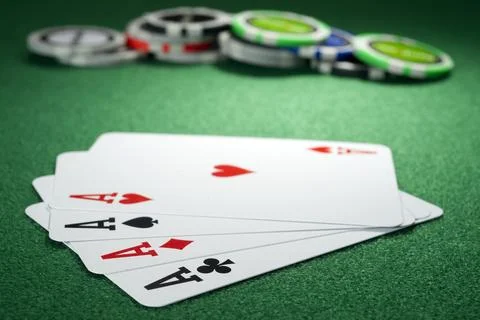 Four aces and chips on a green felt Stock Photos