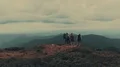 The four active people standing on a beautiful mountain 4k or 4k+ Resolution