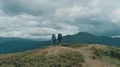 The four active people standing on the mountain with a picturesque landscape 4k or 4k+ Resolution