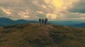The four active people standing on the mountain 4k or 4k+ Resolution