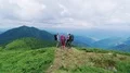 The four active people standing on the mountain with a beautiful landscape 4k or 4k+ Resolution