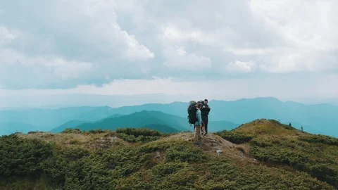 The four active people standing on the mountain Stock Footage 116074226