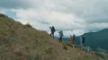 The four active people walking up on the mountain 4k or 4k+ Resolution