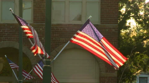 Four American Flags at Sunset Stock Footage 54622181