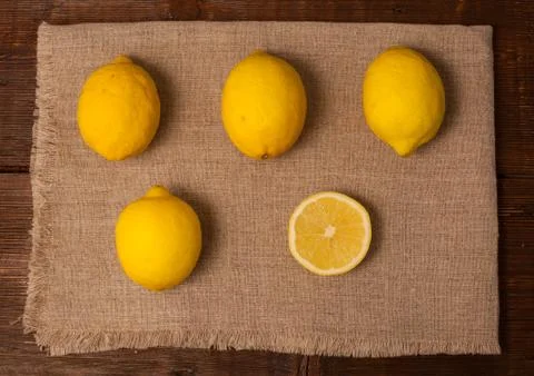 Four and a slice lemons Stock Photos