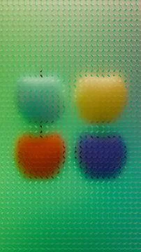 Four apple silhouettes behind circle grid pattern on green gradient backgro.. イラスト素材