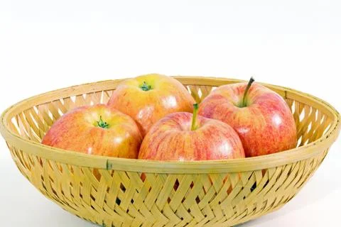 Four apples in a basket Foto stock