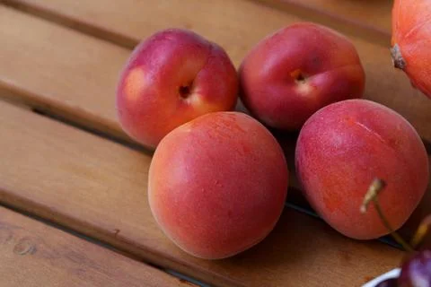 Four apricots on a table. Stock-Fotos