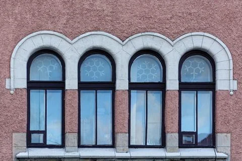 Four arched windows. Stock Photos