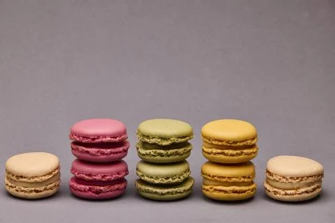 Four assorted macarons on gray background Stock Photos