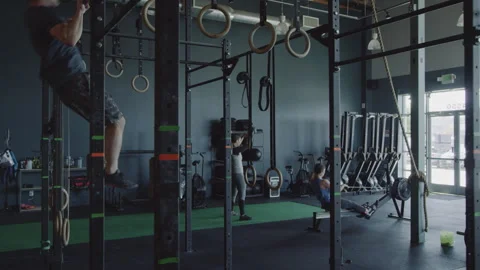 Four athletes training together in a small gym using various equipment Stock Footage 312705926