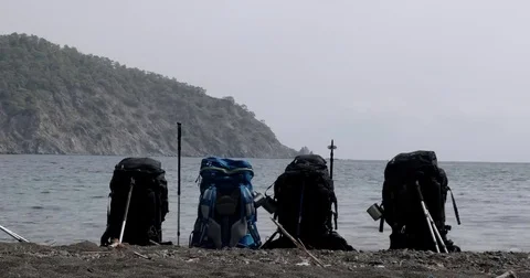 Four Backpacks on the Summer Beach Stock Footage 69182676