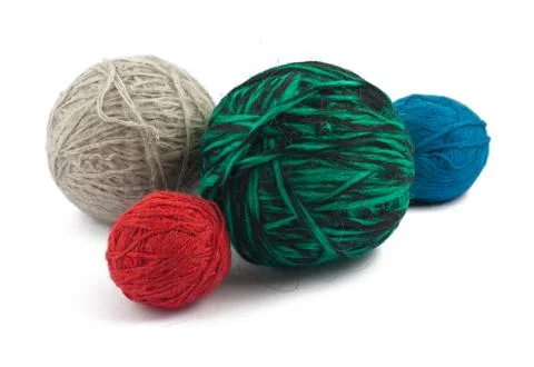 Four balls of wool on white background Stock Photos