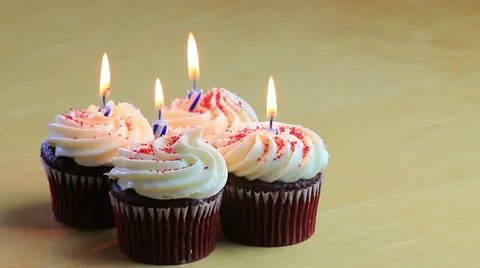 Four birthday cupcakes Stock Footage 11157423