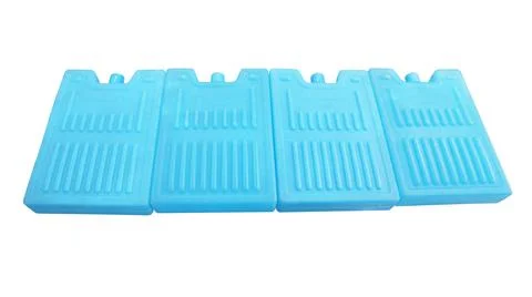 Four blue plastic ice pack coolers arranged in a row isolated on a white ba.. Stock Photos