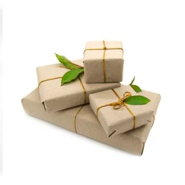 Four boxes packed in brown paper Stock Photos