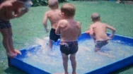 Four Boys Play In A Small Pool In The Backyard 1950S Family Home Movie 6021 Stock Footage
