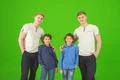 The four brothers stand on the green background Photo
