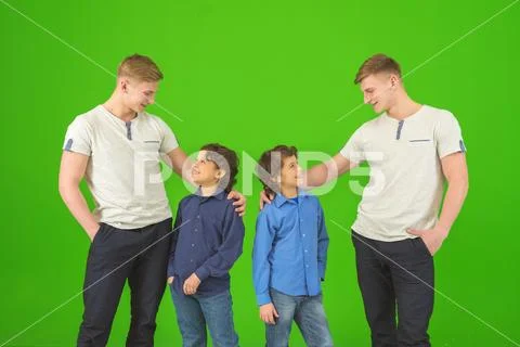 The four brothers stand on the green background Stock Photos