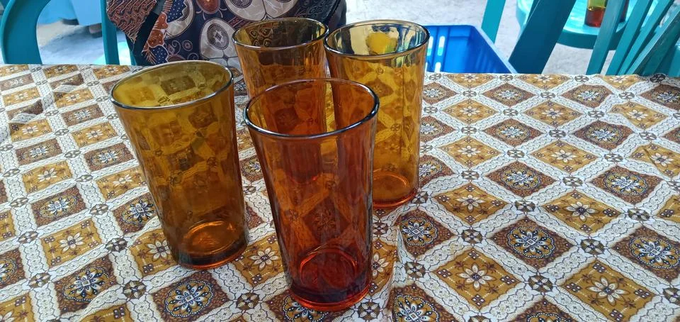Four Brown Glasses Stock-Fotos