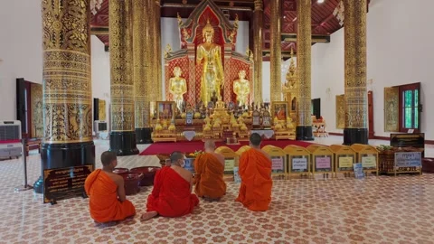 Four Buddhist monks praying inside a temple in Chiang Mai, Thailand. Stock Footage 336581638