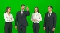 The four business people work with a virtual screen on the green background 4k or 4k+ Resolution