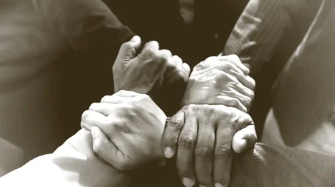 Four businessmen join hands Stock Footage 56614805
