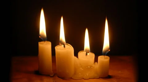Four candles burning Stock-Footage 64803661
