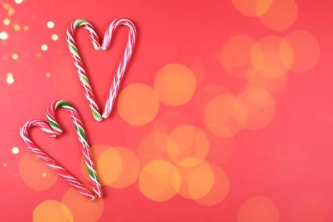 Four candy canes on red background. Stock Photos
