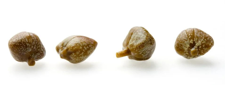 Four capers in a row Stock Photos