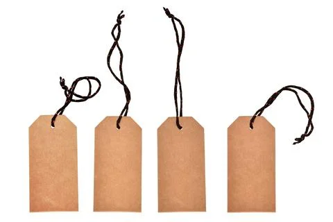 Four cardboard tags with threads on a white background Stock Photos