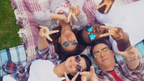 Four carefree young students posing for camera Stock Footage 127913321