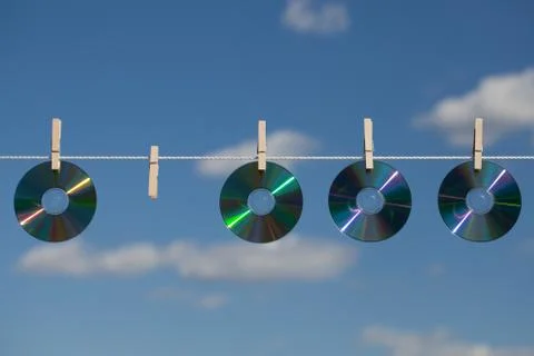 Four cds on a clotheslines Stock Photos