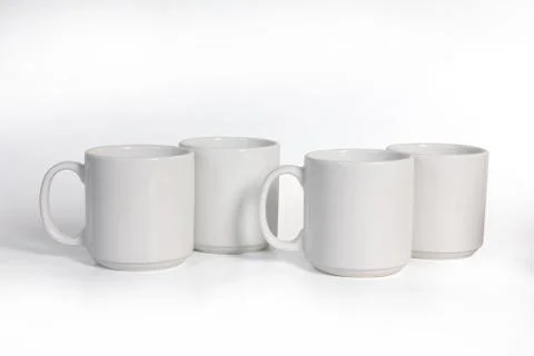 Four Ceramic Cups Isolated on White Background, Side View Stock Photos